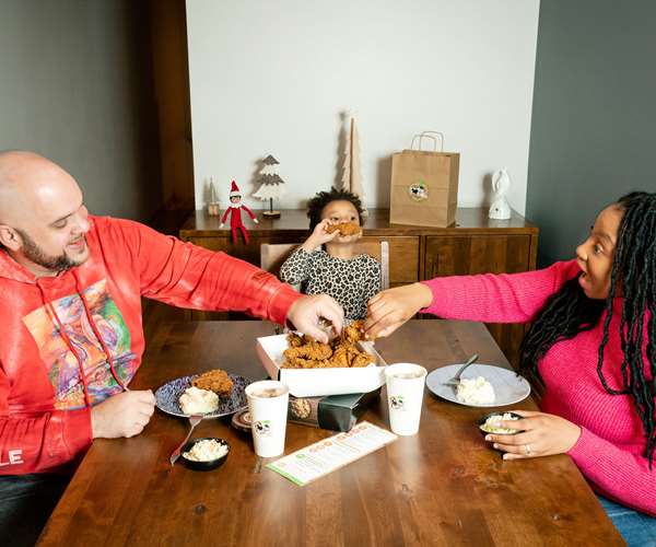 A family having Sugapeach at the dining table